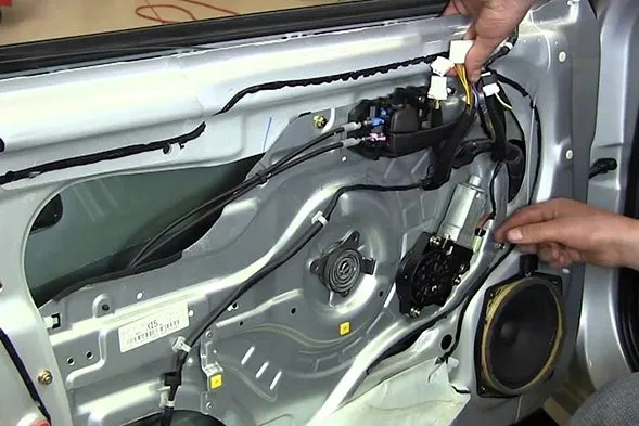 Car door panel removed to repair a power window motor and regulator in Las Vegas