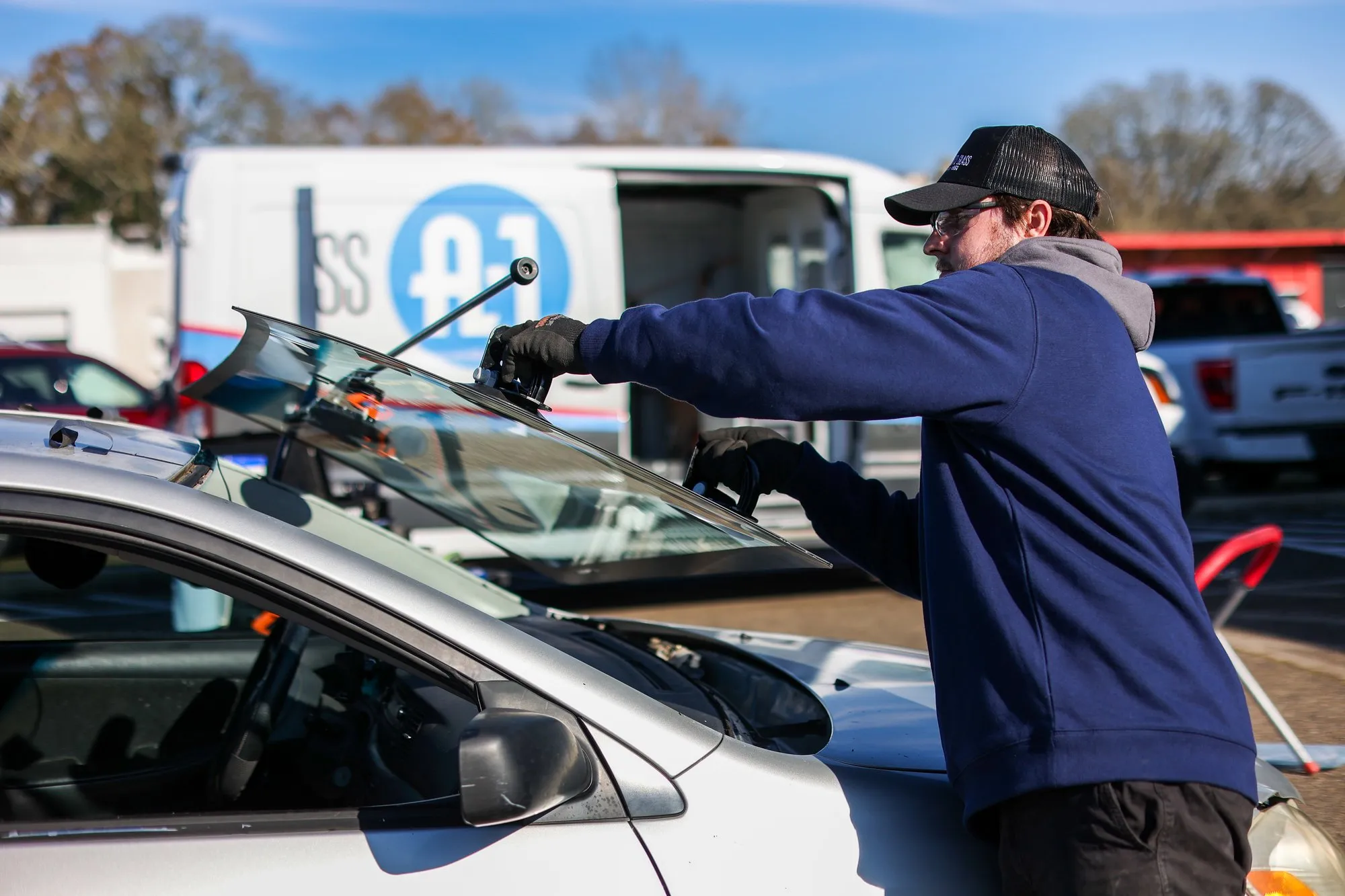 New windshield being set into a vehicle during a mobile replacement in Las Vegas